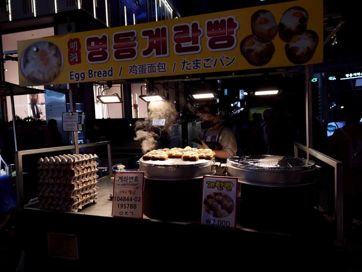A food stand with food on it at night in Korea