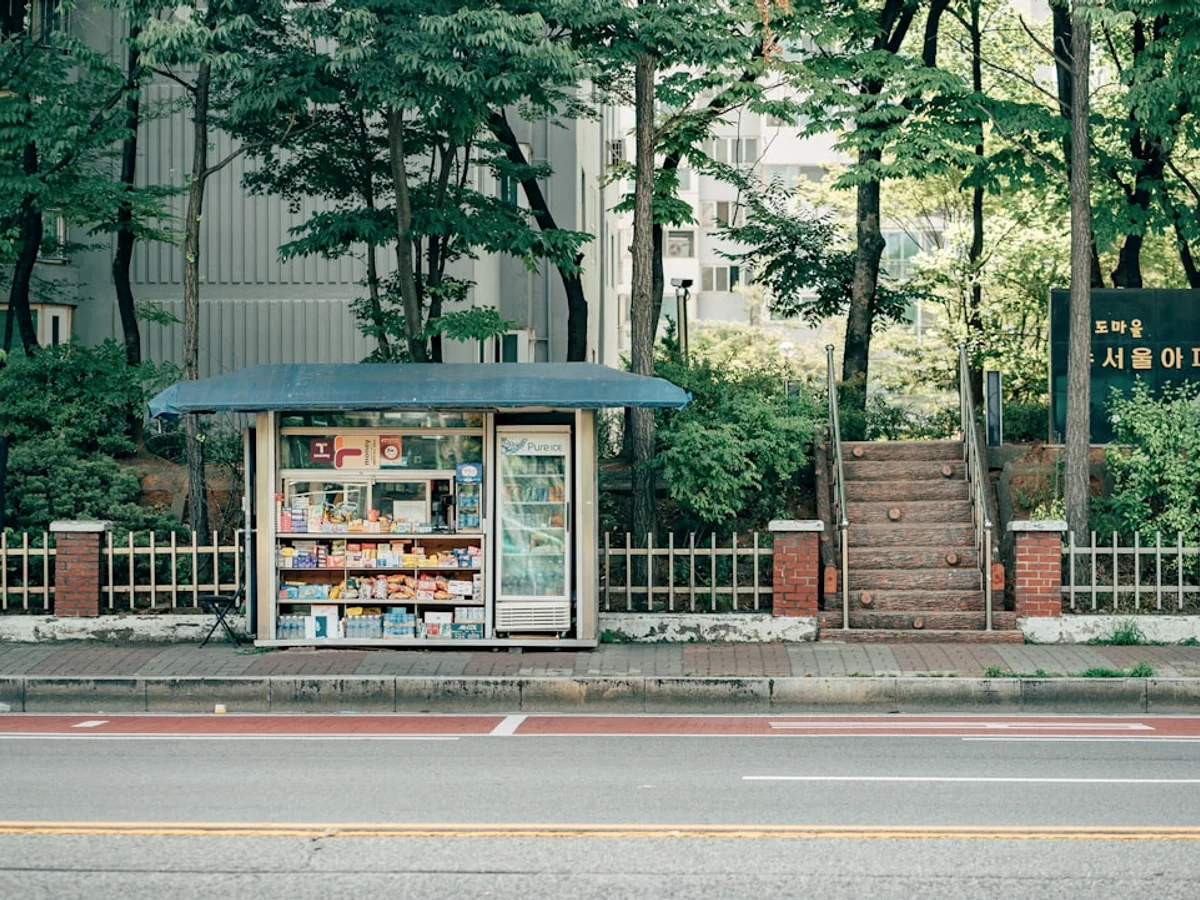 Green trees near brown building during daytime related to Discover the best snacks, in Korea